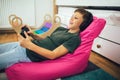 Boy with gamepad playing video game at home Royalty Free Stock Photo