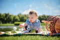 Little boy in the garden. Picnic.