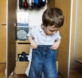Little boy getting dressed by himself Royalty Free Stock Photo
