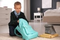 Little boy getting ready for school in bedroom Royalty Free Stock Photo