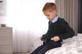 Little boy getting ready for school in bedroom Royalty Free Stock Photo