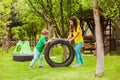 The little boy and girl arrange a playground for themselves