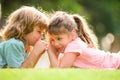 Little boy and girl best friends hugging. Kids kissing each other with love at summer park. Little friends. Blond kids