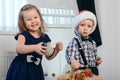 Little boy and girl in Christmas decorations expect a miracle Royalty Free Stock Photo