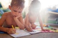 Little boy and girl drawing with crayons Royalty Free Stock Photo