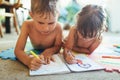 Little boy and girl drawing with crayons Royalty Free Stock Photo