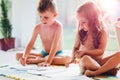 Little boy and girl drawing with crayons Royalty Free Stock Photo