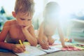 Little boy and girl drawing with crayons Royalty Free Stock Photo