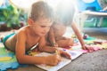 Little boy and girl drawing with crayons Royalty Free Stock Photo