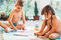 Little boy and girl drawing with crayons Royalty Free Stock Photo