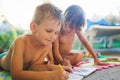 Little boy and girl drawing with crayons Royalty Free Stock Photo