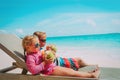 Little boy and girl drinking coconut on beach vacation Royalty Free Stock Photo