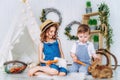 Little boy and girl feeding rabbits carrots learning to take care of an animal. Happy childhood