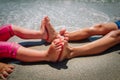 Little boy and girl feet on beach sand, kids play at sea Royalty Free Stock Photo