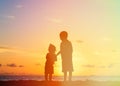 Little boy and girl holding hands at sunset Royalty Free Stock Photo