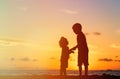 Little boy and girl holding hands at sunset Royalty Free Stock Photo