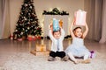 The little boy and girl open Christmas presents Christmas tree new year`s Eve family celebration Royalty Free Stock Photo