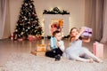 The little boy and girl open Christmas presents Christmas tree new year`s Eve family celebration Royalty Free Stock Photo