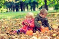 Little boy and girl play with autumn leaves in nature Royalty Free Stock Photo