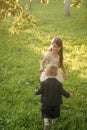 Little boy and girl play on green grass, energy Royalty Free Stock Photo