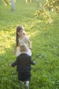 Little boy and girl play on green grass, energy Royalty Free Stock Photo