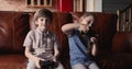 Little boy and girl play home video game console