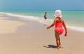 little boy and girl play with water on beach Royalty Free Stock Photo