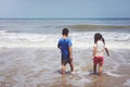 Little boy and girl playing on the beach Royalty Free Stock Photo