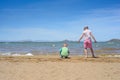 Little boy and girl playing on the beach Royalty Free Stock Photo