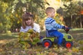 Little boy and girl playing in the park on a beautiful autumn da Royalty Free Stock Photo