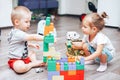 little boy and girl playing toys at home Royalty Free Stock Photo