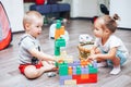 little boy and girl playing toys at home Royalty Free Stock Photo