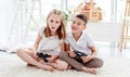 Little boy and girl playing video game Royalty Free Stock Photo