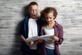 Little boy and girl reding a book against airflow