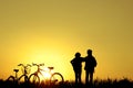 Little boy and girl riding bikes at sunset, active kids sport, A Royalty Free Stock Photo