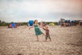 little boy and girl run in the summer along the seashore, holding hands. Brother and sister in natural clothes. Tourism Royalty Free Stock Photo