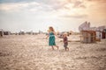 little boy and girl run in the summer along the seashore, holding hands. Brother and sister in natural clothes. Tourism Royalty Free Stock Photo