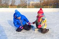 Little boy and girl skating together, kids winter sport Royalty Free Stock Photo