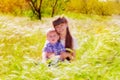 Little boy and girl in the summer field with flowers Royalty Free Stock Photo