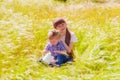 Little boy and girl in the summer field with flowers Royalty Free Stock Photo