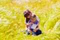 Little boy and girl in the summer field with flowers Royalty Free Stock Photo