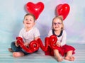 Little boy and girl toddlers with red heart balloons. Valentines day concept Royalty Free Stock Photo