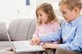 Little boy and girl using laptop Royalty Free Stock Photo