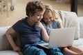 Little boy and girl using laptop, watching cartoons or playing Royalty Free Stock Photo