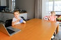 A little boy and a girl watch cartoons on a laptop Royalty Free Stock Photo