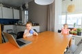 A little boy and a girl watch cartoons on a laptop Royalty Free Stock Photo