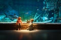 Little boy and girl watching fishes in aquarium Royalty Free Stock Photo