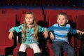 Little boy and girl watching a movie Royalty Free Stock Photo