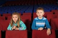 Little boy and girl watching a movie Royalty Free Stock Photo