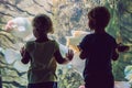 Little Boy and girl watching tropical coral fish in large sea life tank. Kids at the zoo aquarium Royalty Free Stock Photo